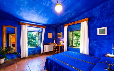 Dark blue double bedded room